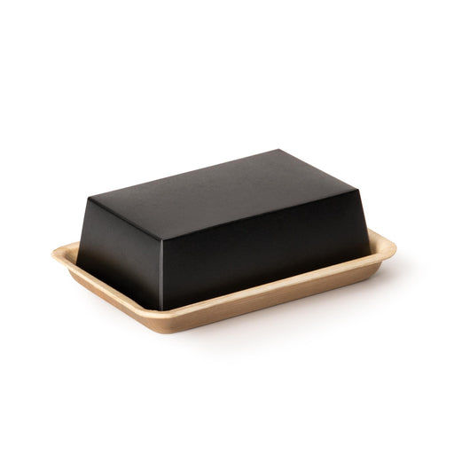 Zweiteilige, rechteckige Take-away-Box aus Kraftpapier. 
Die hellbeige Bodenplatte aus Palmblatt, mit erhöhtem Rand dient als Basis, auf die eine obere, schwarze Kraftpapier-Box gesteckt wird. Innovatives Einweggeschirr.